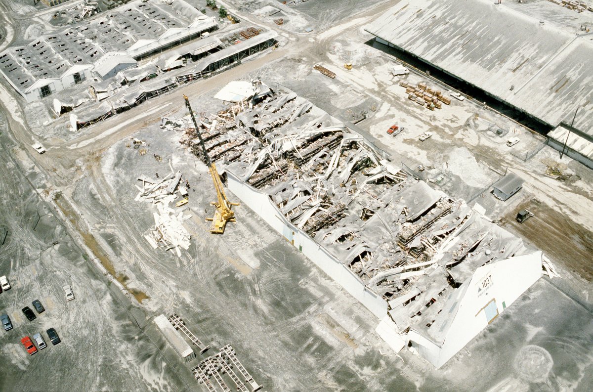 Ash from Mount Pinatubo collapses buildings at Subic Naval Base.